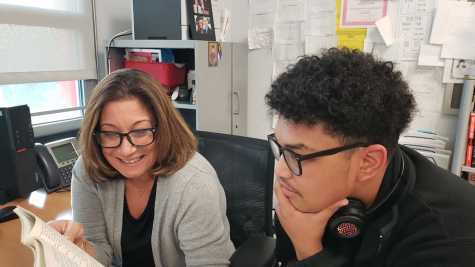 English teacher Jennifer Todisco and Joseph Lopez 26 discuss an upcoming assignment. Last year at this time, these face-to-face meetings were not possible because of concerns over COVID.