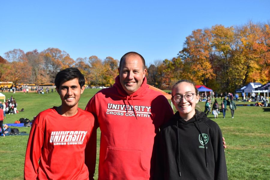 (L to R) Tanmay Thaker ‘24, Coach Brown, and Catherine Hockenhull ‘25 taking a picture together.