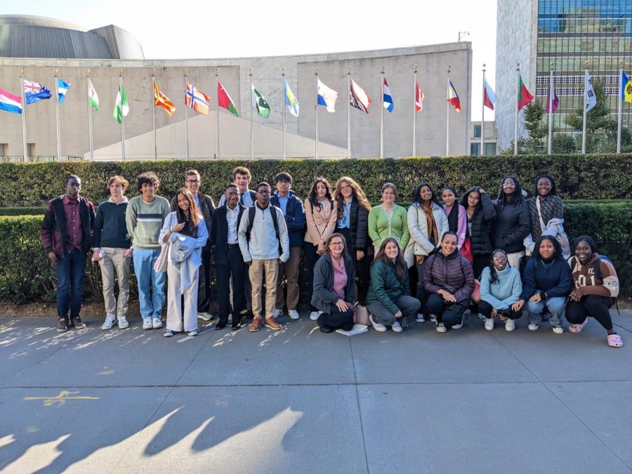 The Model UN club posing in front of the United Nations building.