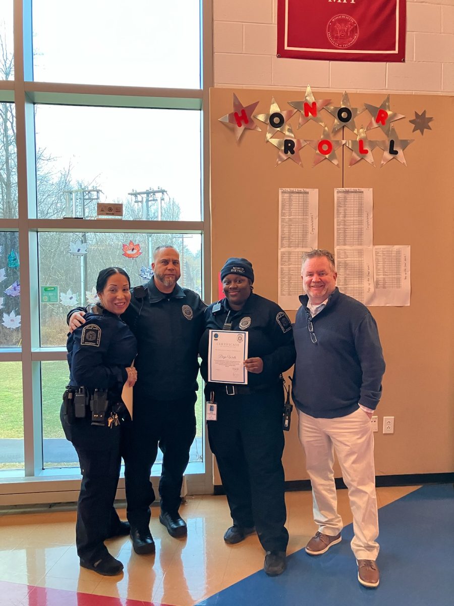 Union presidents Kathy Rodriguez and Davey Valez, along with UHSSE Principal Sean Tomany pictured with officer Watts as she receives her award. 