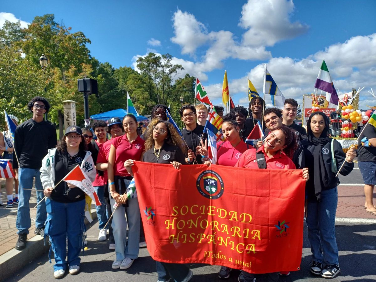 Students pictured with Mrs. Faria at Hispanic Heritage Month Parade.