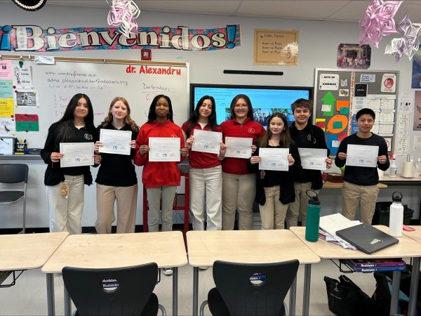 Students pictured with certificates from the UHart conference 