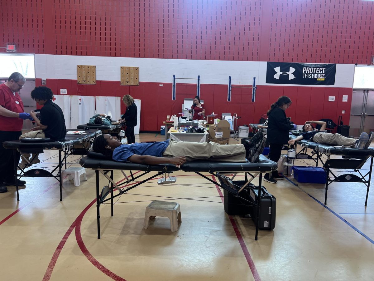 Students pictured donating blood on April 22 in the UHSSE gymnasium. 